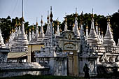 Myanmar - Mandalay, Sandamuni Pagoda. The entire ground is covered with 1749 small white pagodas with stone slabs with the Buddhist Tripitaka. 